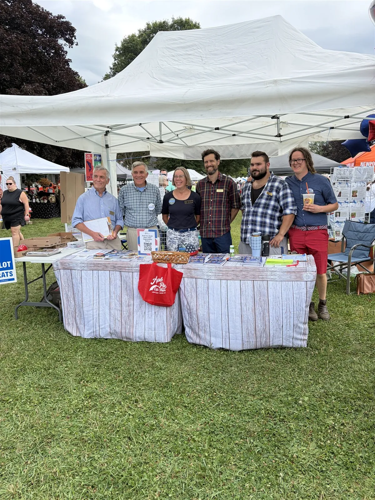 Sam Deering and volunteers meeting voters at a county fair booth
